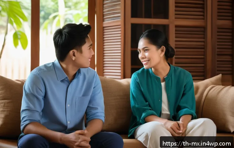 비폭력 커뮤니케이션을 통한 건강한 관계 유지 - A calm and cozy Thai home living room scene showing two adult Thai individuals engaged in a respectf...